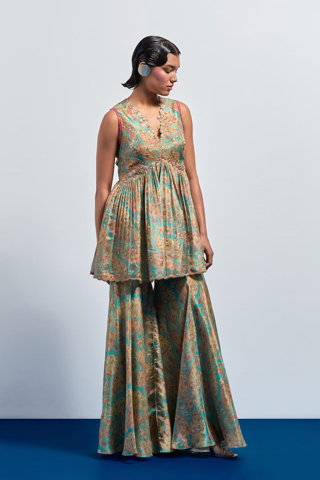 Saga green embroidered peplum sharara set