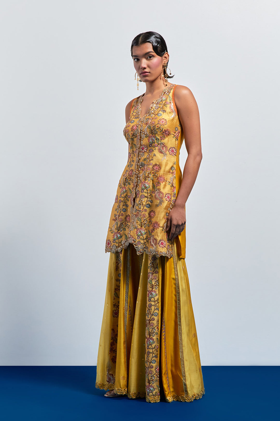 Mustard yellow embroidered peplum sharara set