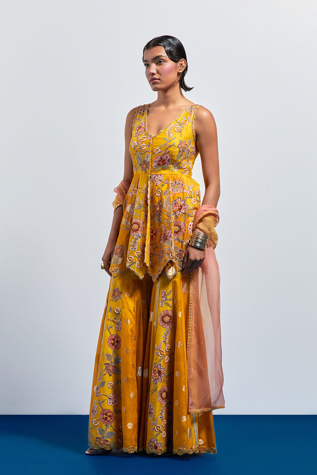Mustard yellow embroidered peplum sharara set