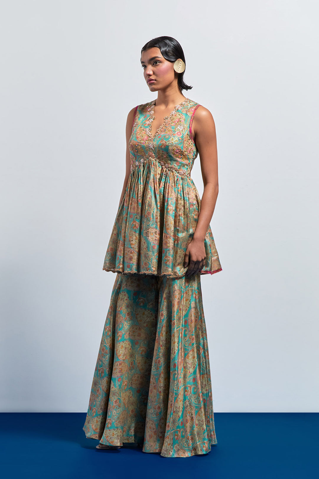 Saga green embroidered peplum sharara set
