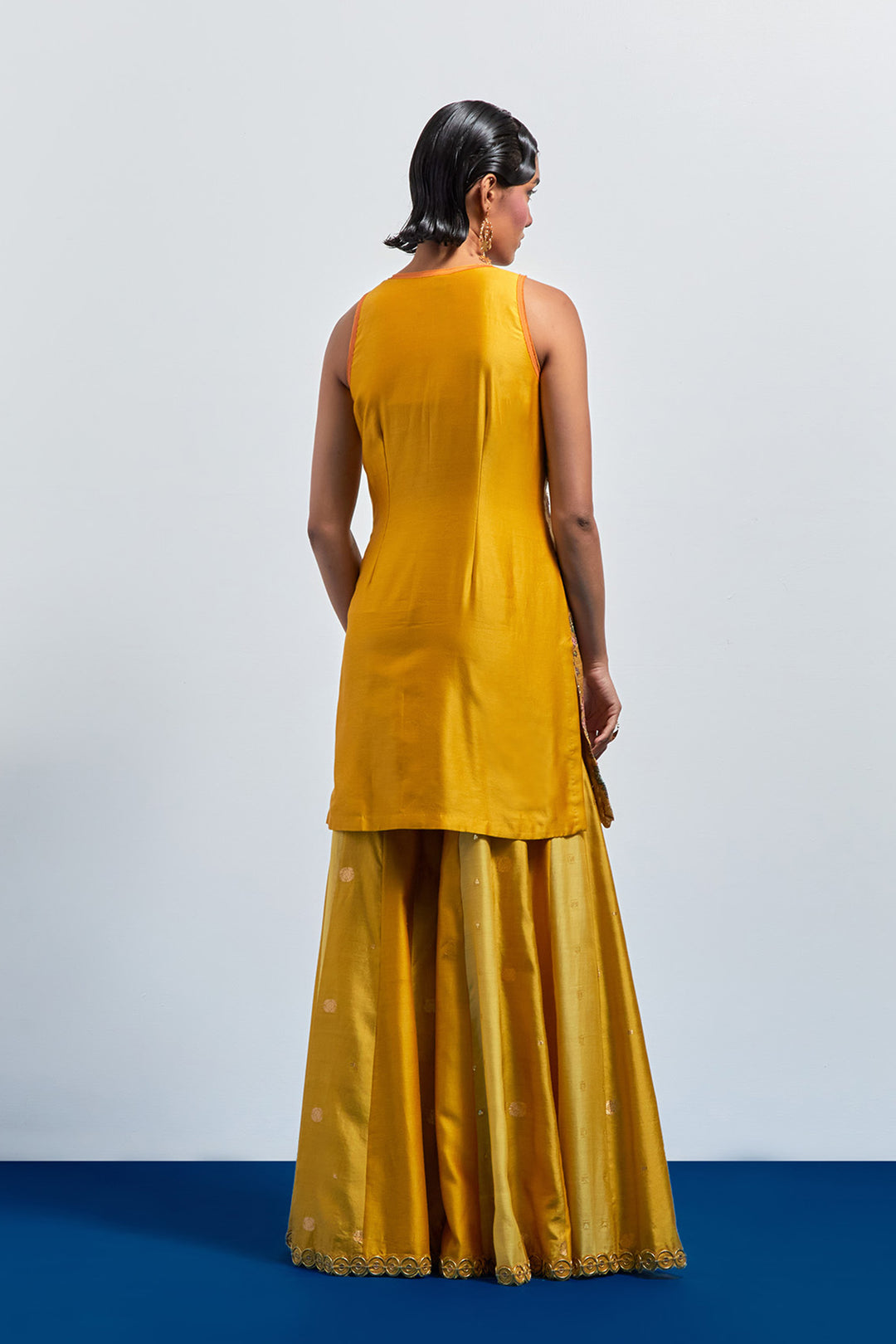 Mustard yellow embroidered peplum sharara set