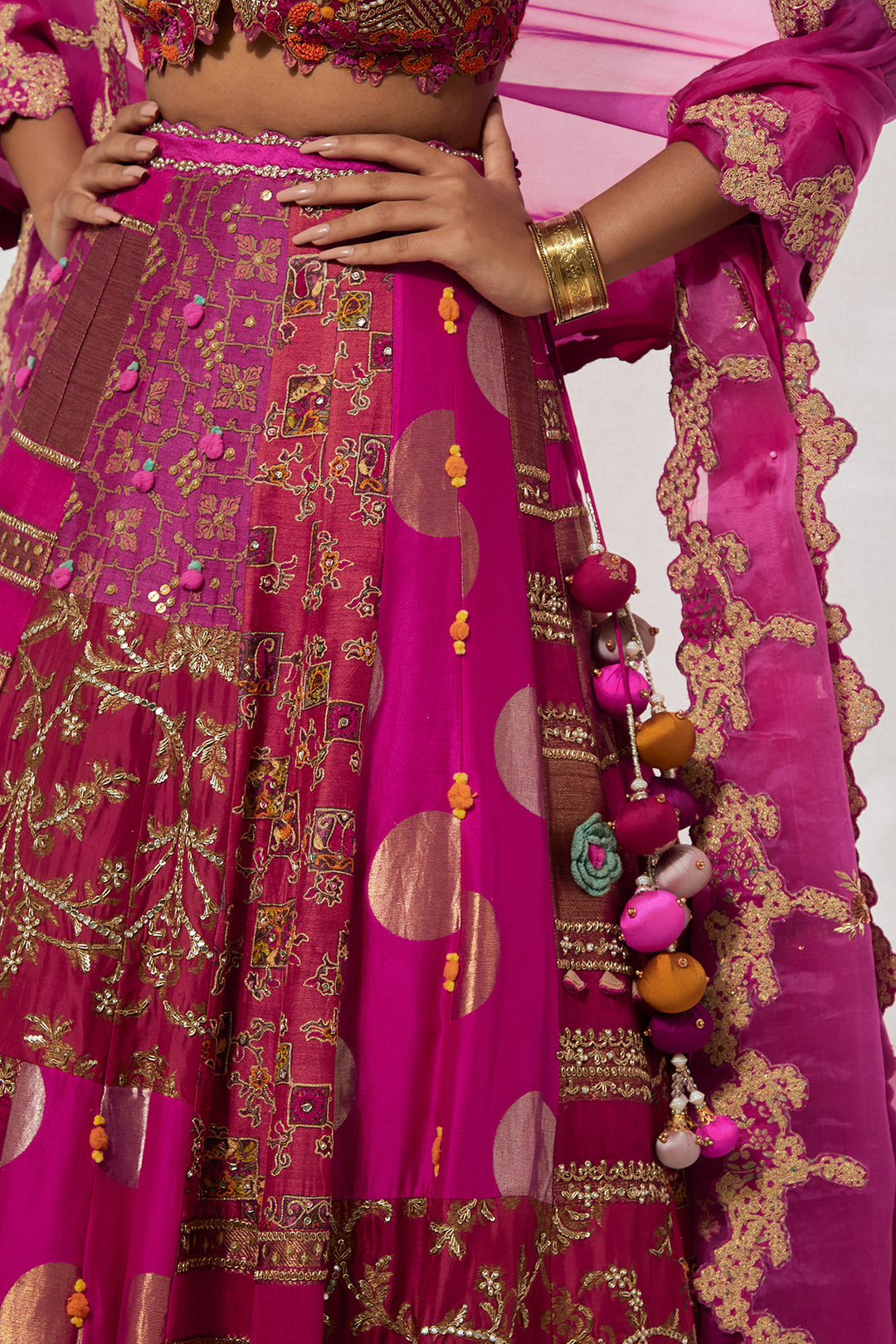 Fuchsia &amp; Rust Orange Multi-Panel Patchwork Lehenga Set with Heavy Pom-Pom Corset Blouse