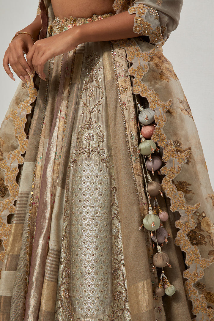 Ivory Taupe Silver Multi-Panel Tissue and Silk Brocade Lehenga Set with 3D Tassel Corset Blouse