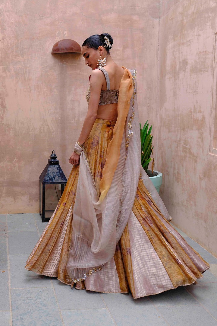 Antique Gold Tissue Lehenga with Embroidered Silk Blouse